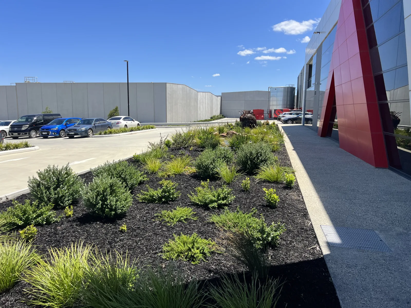 Industrial grounds maintenance, a mown and edged factory frontage in south east Melbourne