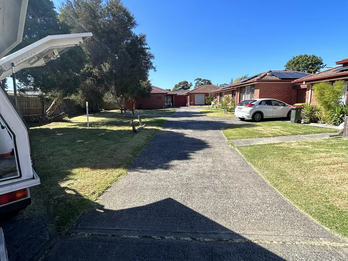 A strata complex shared driveway kept edged and clear, Frankston